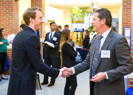 Career Fair Student and Employer shaking hands