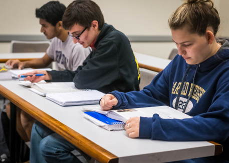 students writing and reading