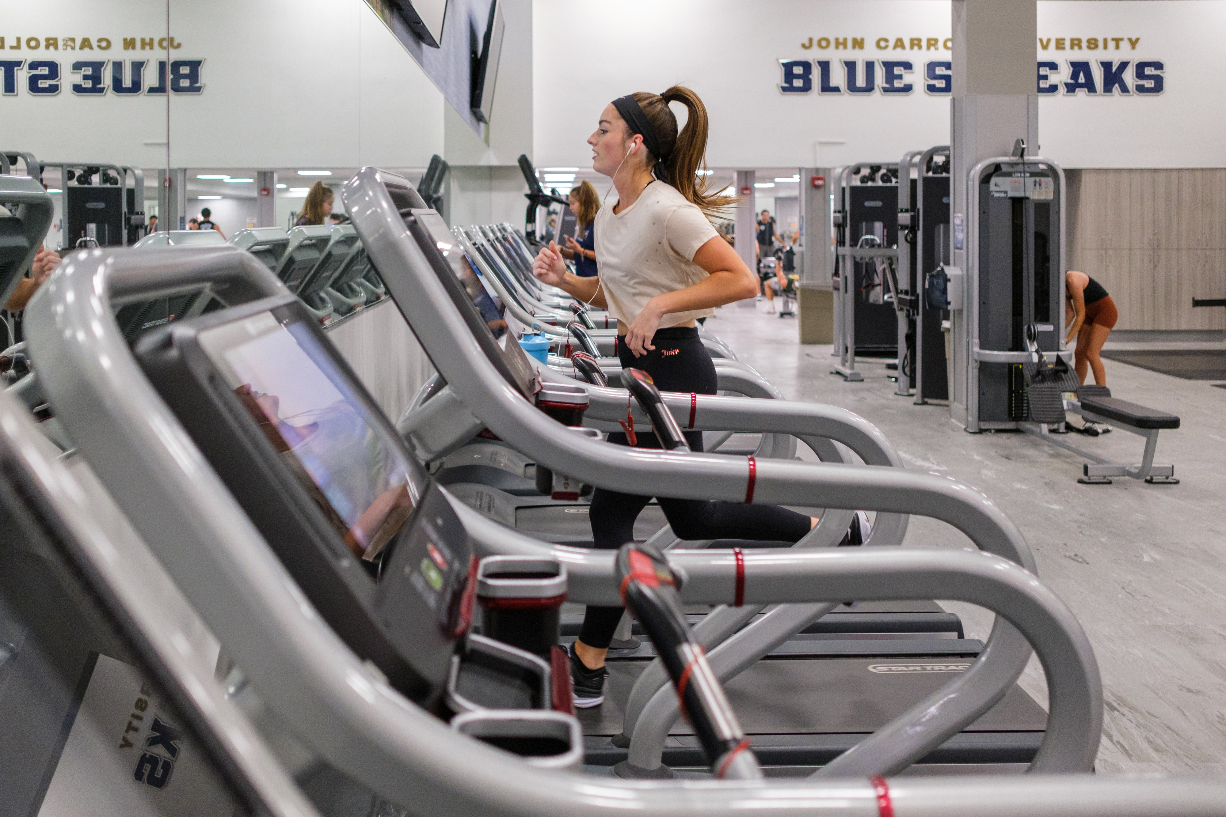 jcu female student running on treadmill