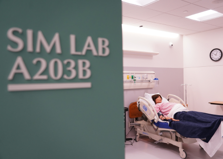 nursing simulation lab entrance with manniquin in background