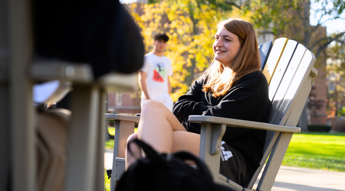 jcu student on the quad smiling