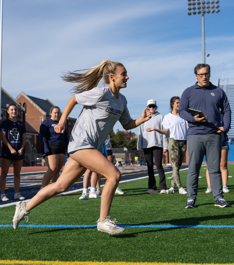 female student running and other students measuring stats