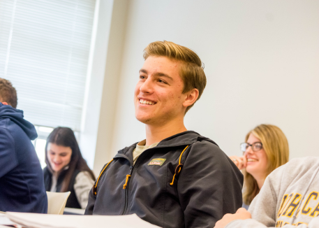 student smiling in classroom