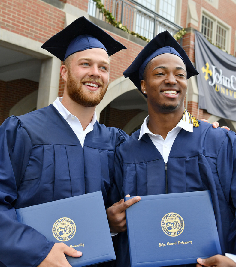 male students in cap and gown