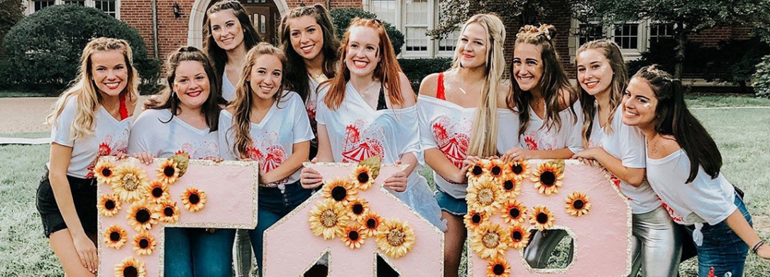 group of girls in sorority with letters
