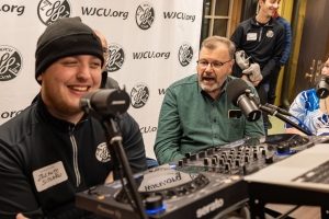 Photo of student broadcasting for WJCU 88.7 FM