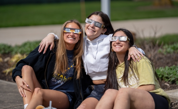 girls watching eclipse