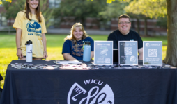 wjcu students smiling at the camera