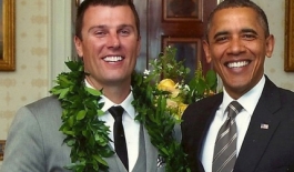 student posing with Barack Obama